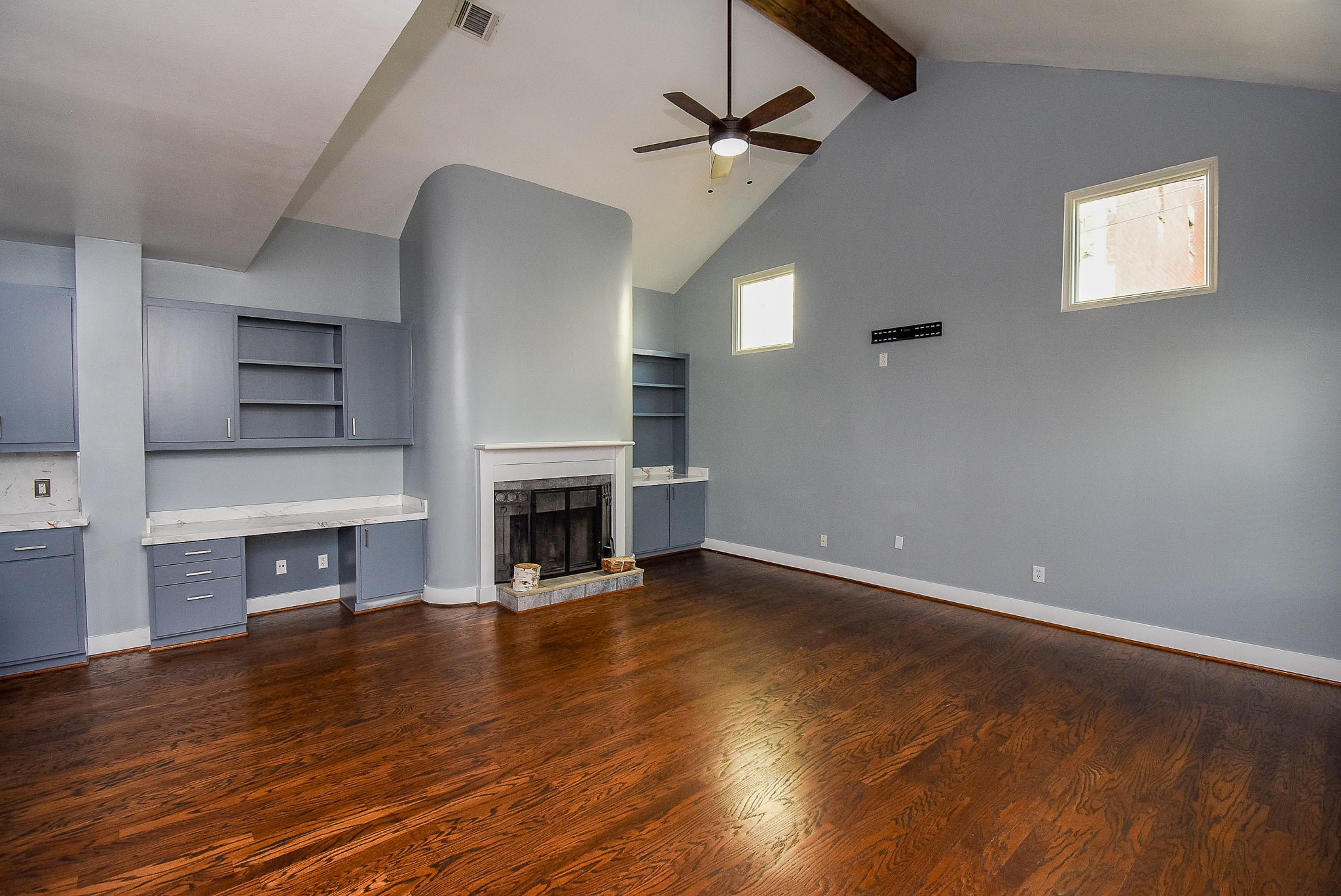 3720 Link Valley Houston, TX 77025 - Photo 6 of 25 an empty room with wooden floor fireplace and windows