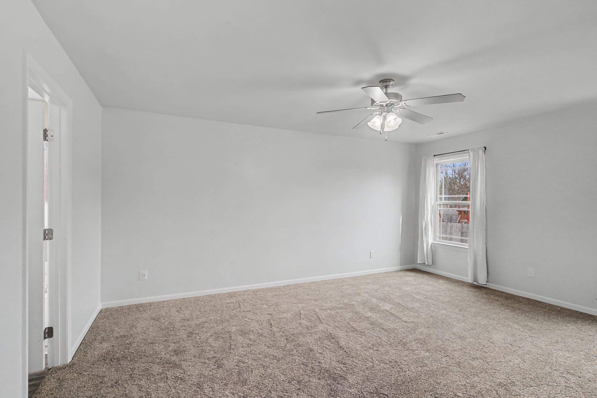 225 Masters Way Fayetteville, TN 37334 - Photo 17 of 31 a view of an empty room with a ceiling fan