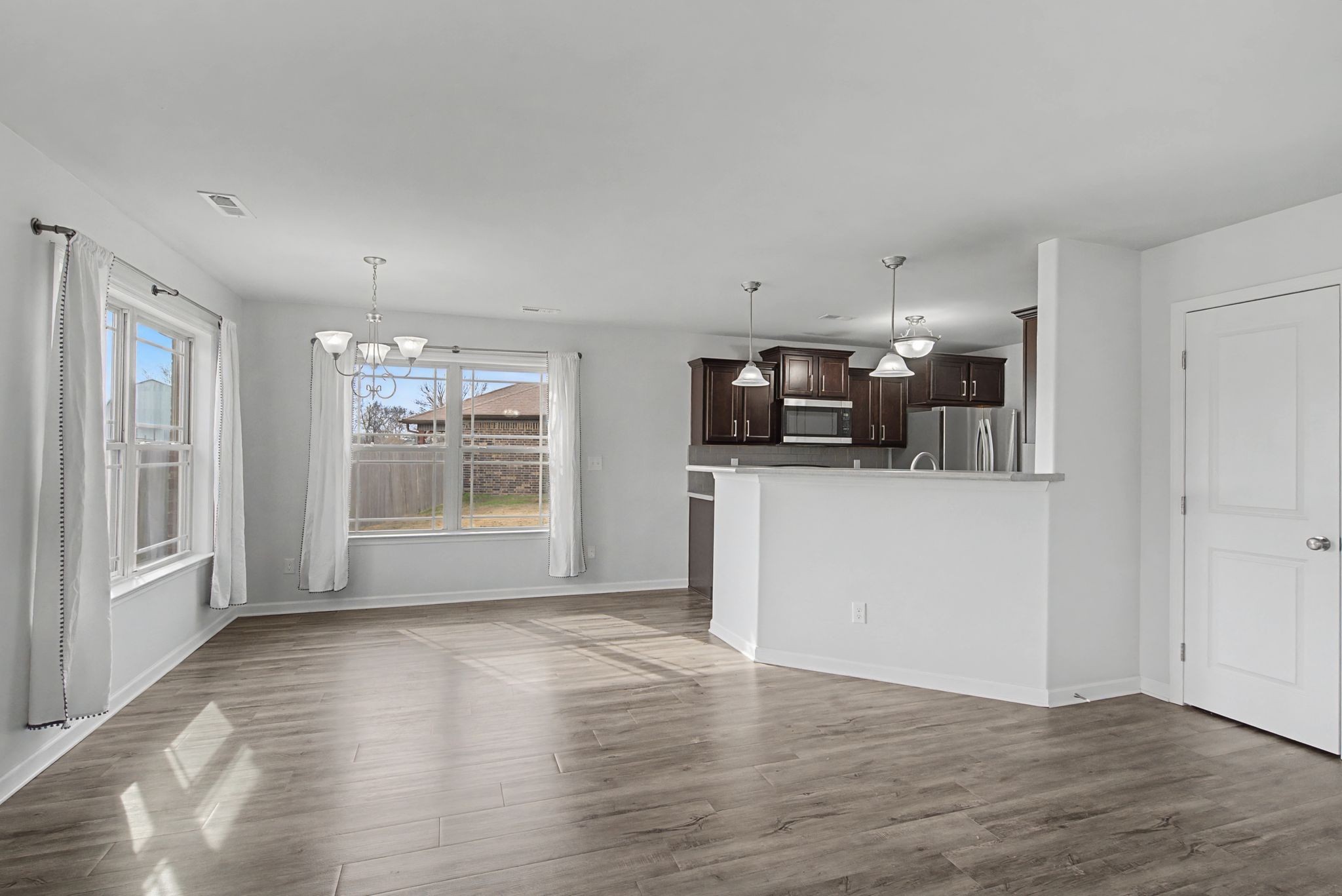 225 Masters Way Fayetteville, TN 37334 - Photo 7 of 31 a view of a kitchen with fridge and wooden floor