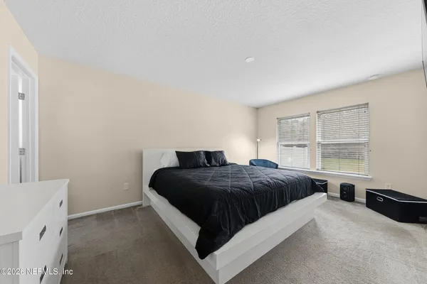 a bedroom with a bed and furniture