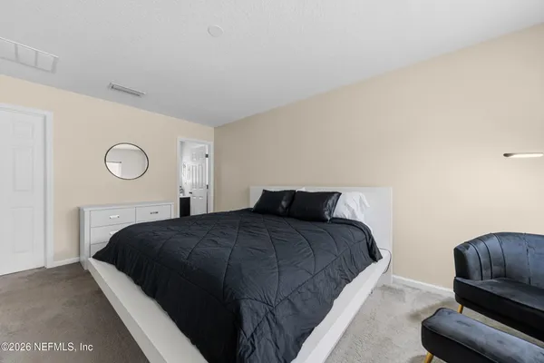 a bathroom with a toilet a sink a bathtub and a mirror