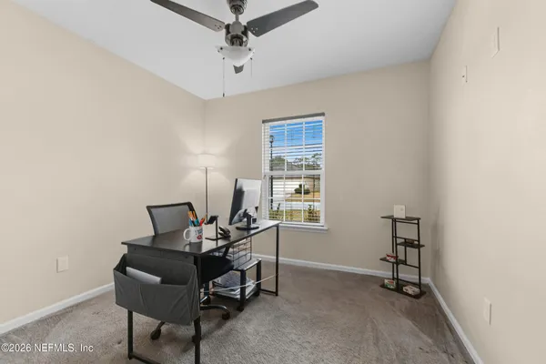 a bathroom with a sink toilet and a mirror