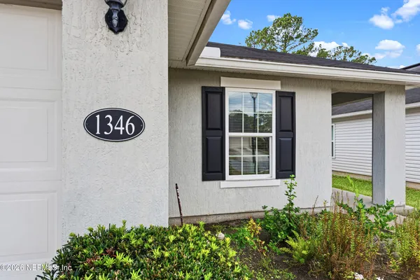 a view of a back yard of the house