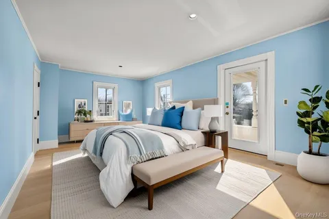 a spacious bedroom with a bed and window