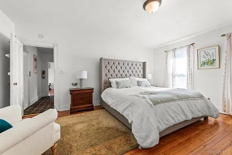 a bedroom with a bed and a couch