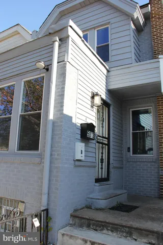a front view of a house with parking