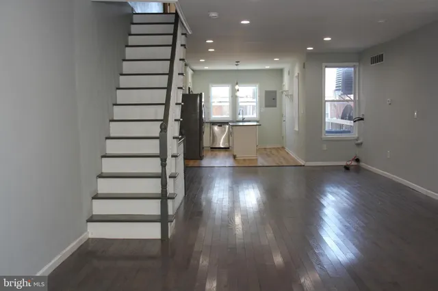 a view of entryway with wooden floor