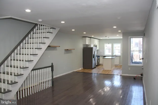 a view of kitchen with furniture and wooden floor