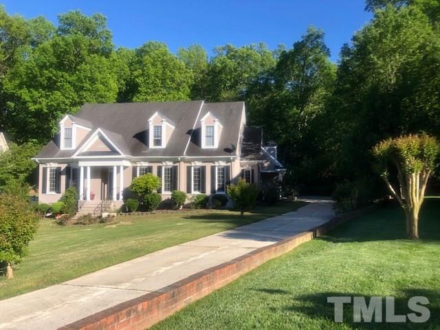 3904 Hemsbury Way Raleigh, NC 27612 - Photo 1 of 20 a front view of a house with a yard