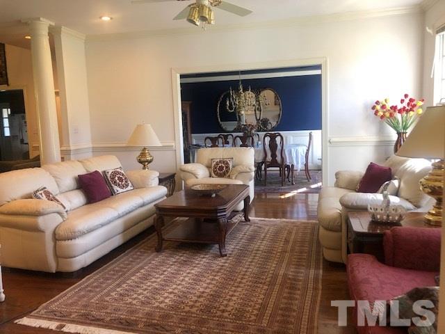 3904 Hemsbury Way Raleigh, NC 27612 - Photo 2 of 20 a living room with furniture and a fireplace