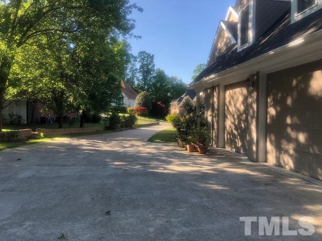 3904 Hemsbury Way Raleigh, NC 27612 - Photo 16 of 20 a view of street with trees
