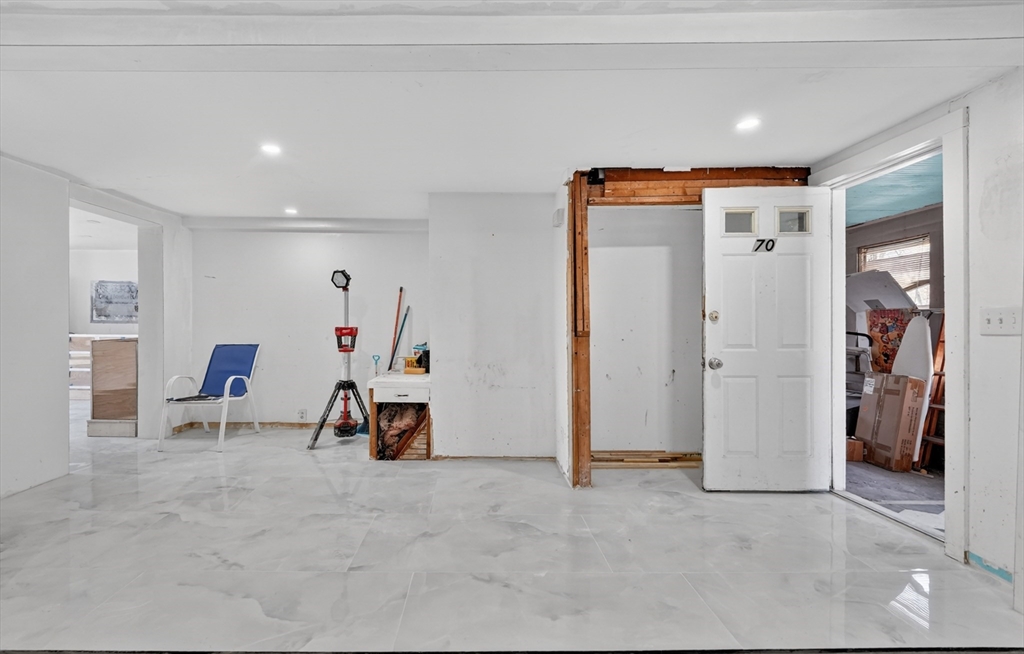 70 Brush Hill Road Milton, MA 02186 - Photo 12 of 26 a room with furniture and white walls