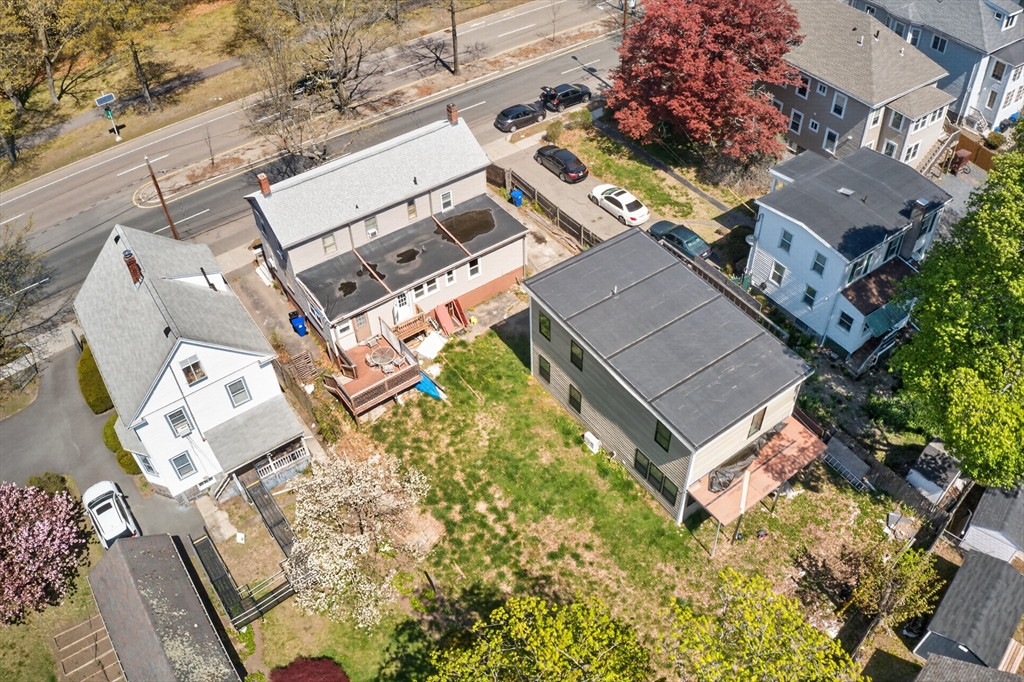 70 Brush Hill Road Milton, MA 02186 - Photo 16 of 26 an aerial view of a house with a yard