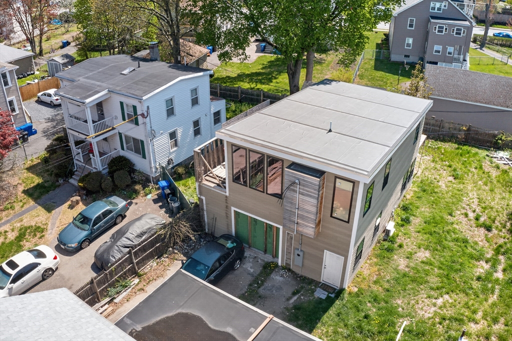 70 Brush Hill Road Milton, MA 02186 - Photo 21 of 26 an aerial view of multiple houses with a yard