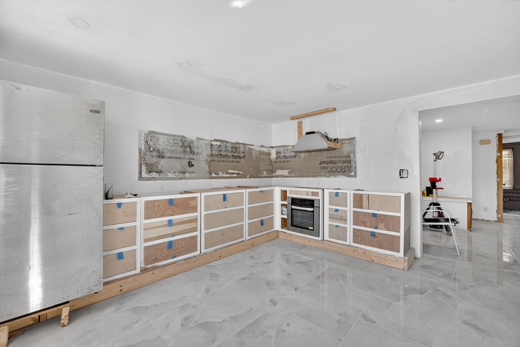 70 Brush Hill Road Milton, MA 02186 - Photo 6 of 26 a view of a kitchen with large window