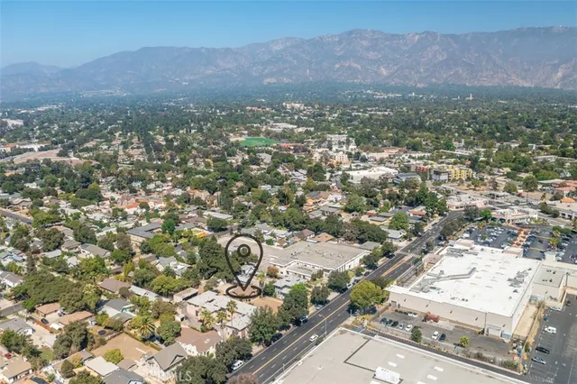 an aerial view of residential houses and city view