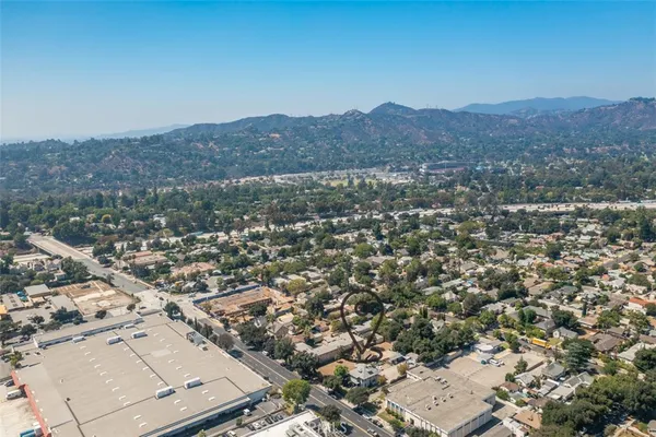 an aerial view of residential house and green space