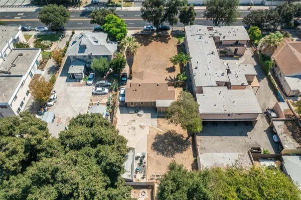 an aerial view of residential houses with outdoor space