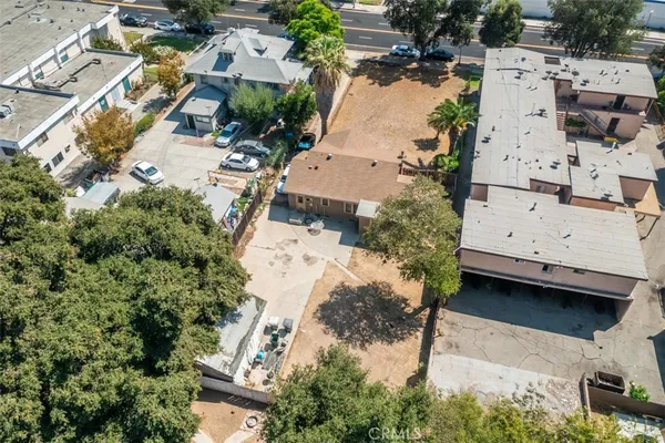 an aerial view of residential houses with outdoor space