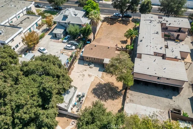 an aerial view of residential houses with outdoor space