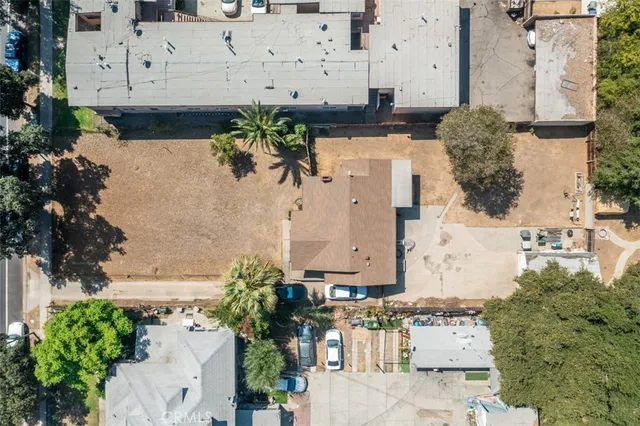 an aerial view of a house with a yard