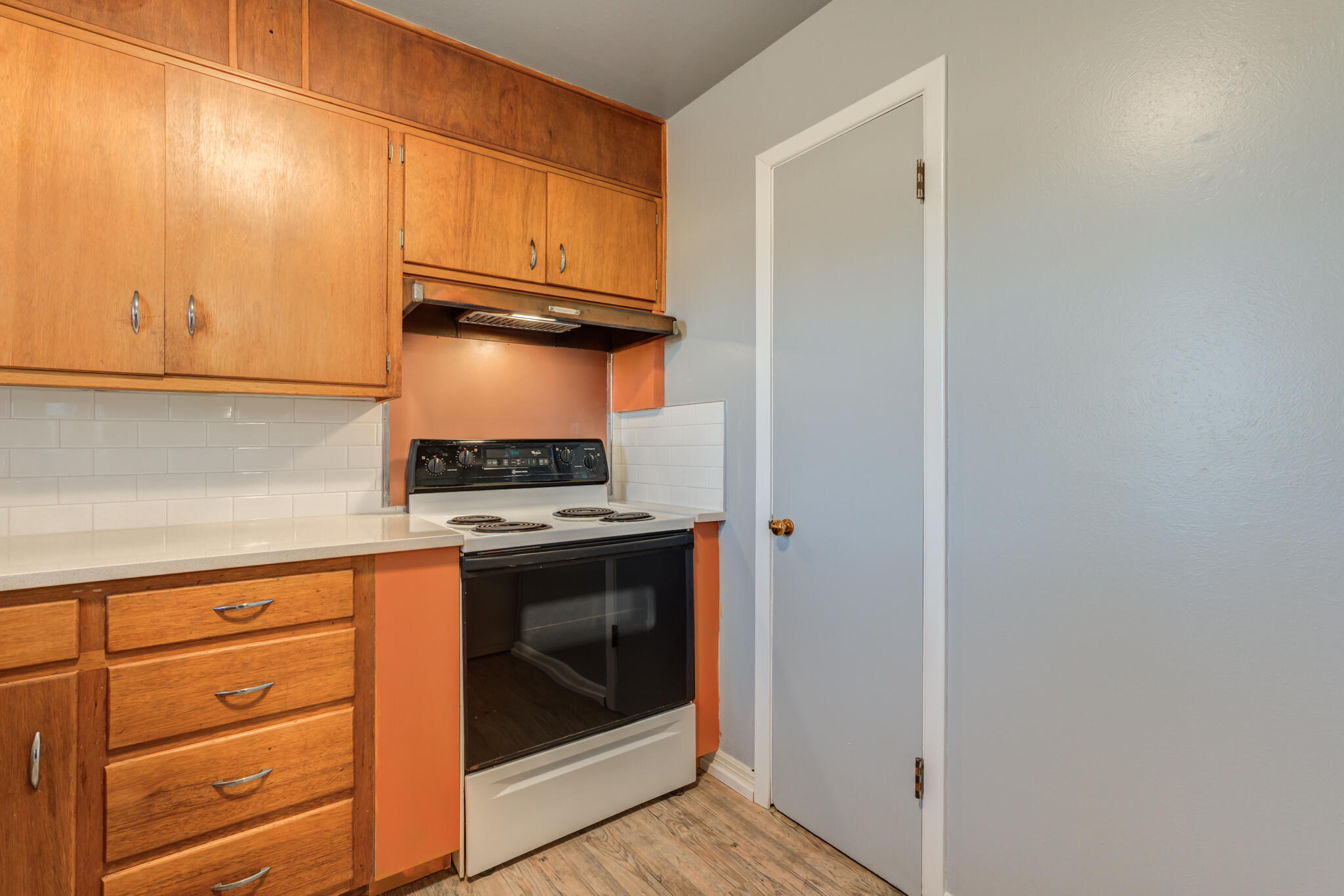 2806 60th Street Lubbock, TX 79413 - Photo 7 of 13 a kitchen with granite countertop cabinets and steel stainless steel appliances