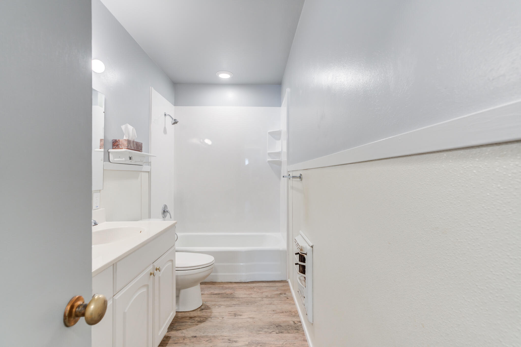 2806 60th Street Lubbock, TX 79413 - Photo 9 of 13 a bathroom with a shower a toilet and a sink