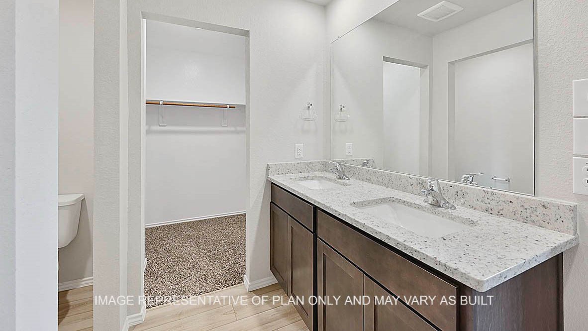 5538 Harriet Street Bryan, TX 77807 - Photo 13 of 17 a bathroom with a granite countertop sink and a mirror