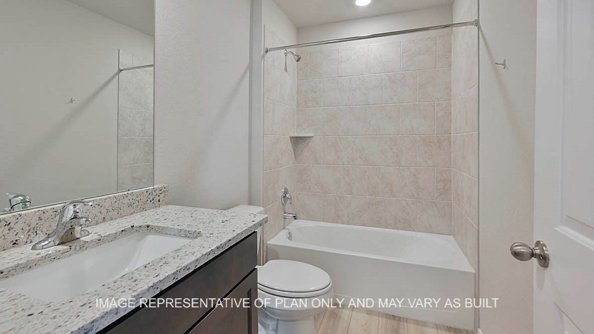 5538 Harriet Street Bryan, TX 77807 - Photo 16 of 17 a bathroom with a granite countertop sink and a mirror