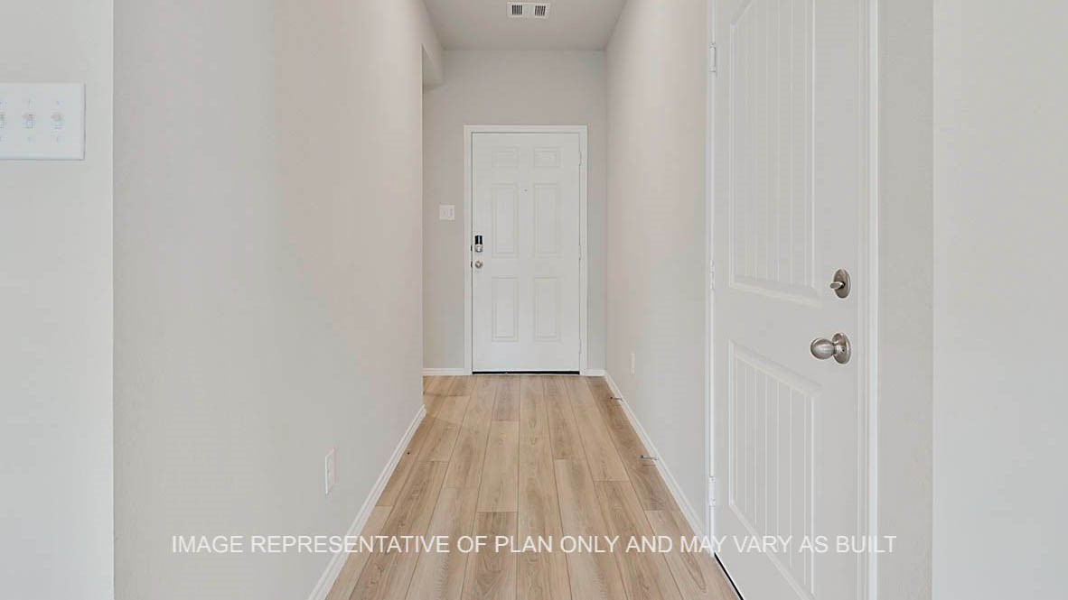 5538 Harriet Street Bryan, TX 77807 - Photo 2 of 17 a view of a hallway with wooden floor