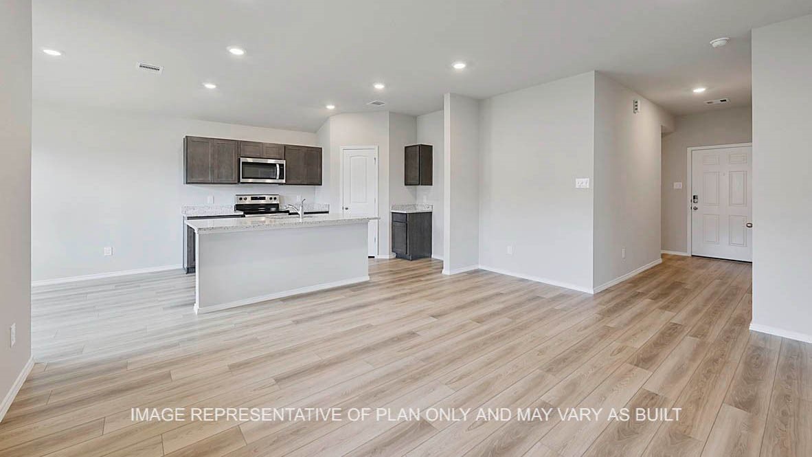 5538 Harriet Street Bryan, TX 77807 - Photo 6 of 17 a view of a kitchen with microwave and cabinets