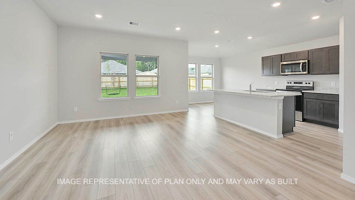5538 Harriet Street Bryan, TX 77807 - Photo 7 of 17 a view of a kitchen with microwave and stove
