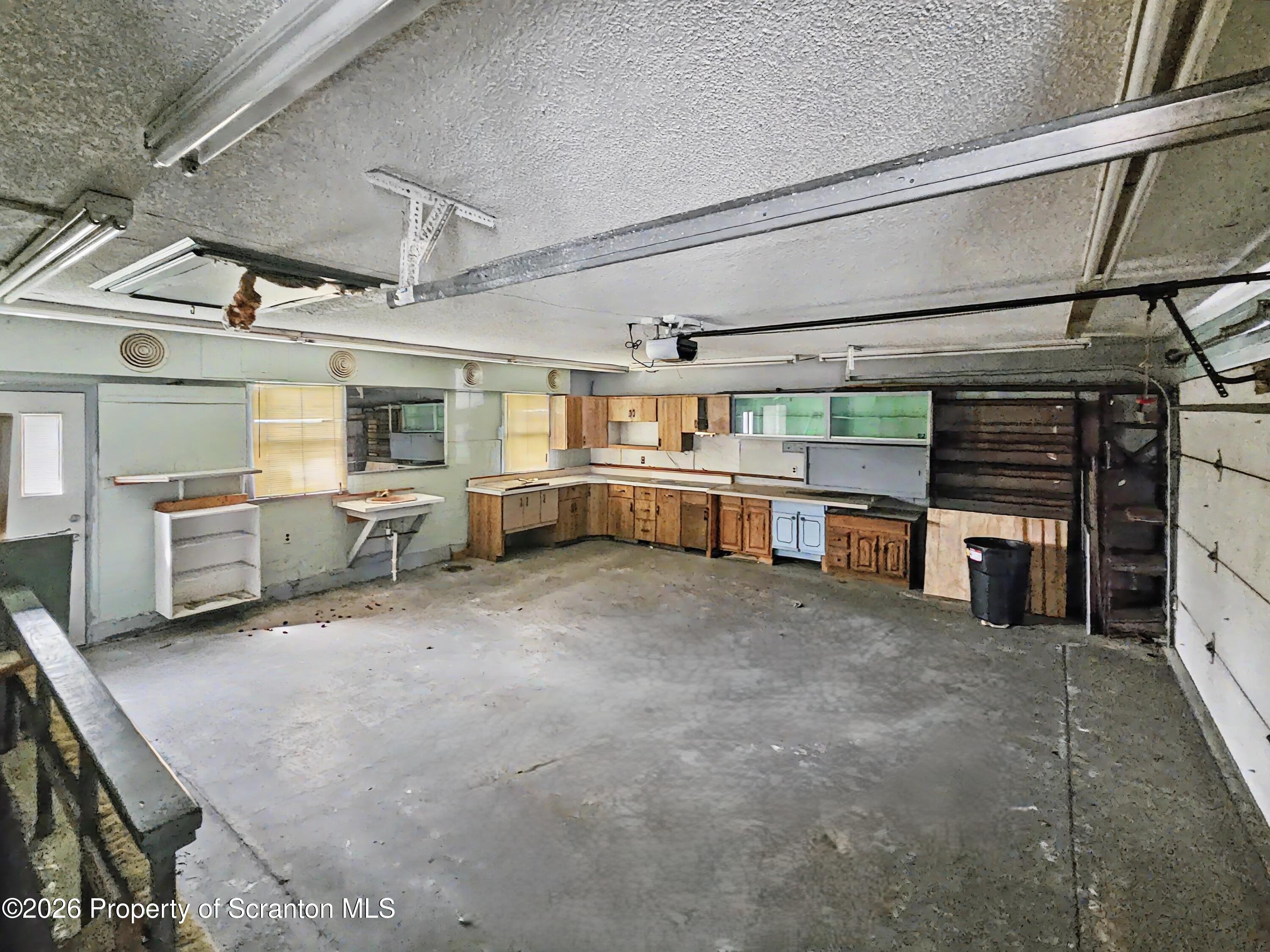134 Lampman Street Avoca, PA 18641 - Photo 17 of 22 a large room with lots of wooden furniture