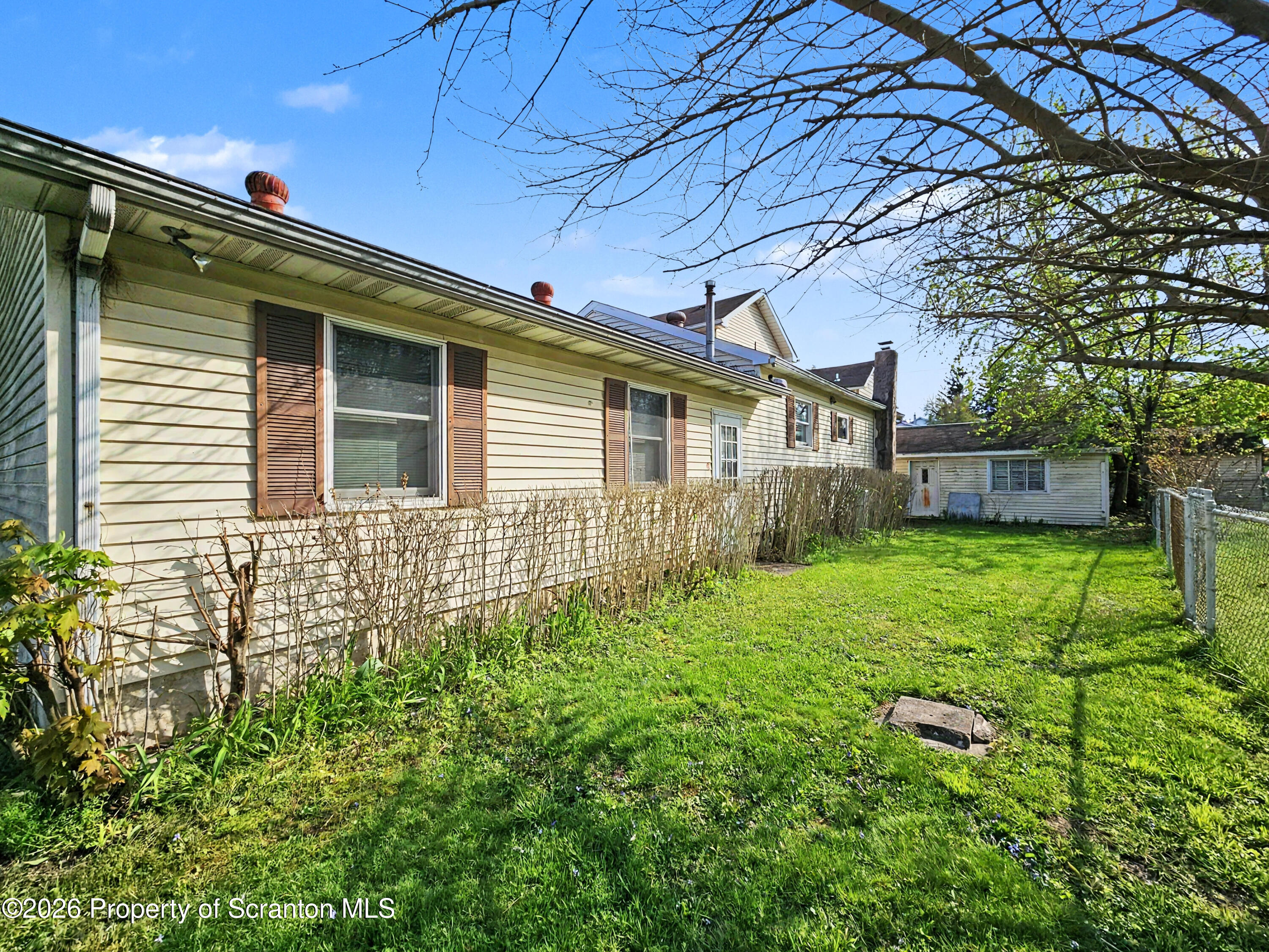 134 Lampman Street Avoca, PA 18641 - Photo 18 of 22 a front view of a house with garden