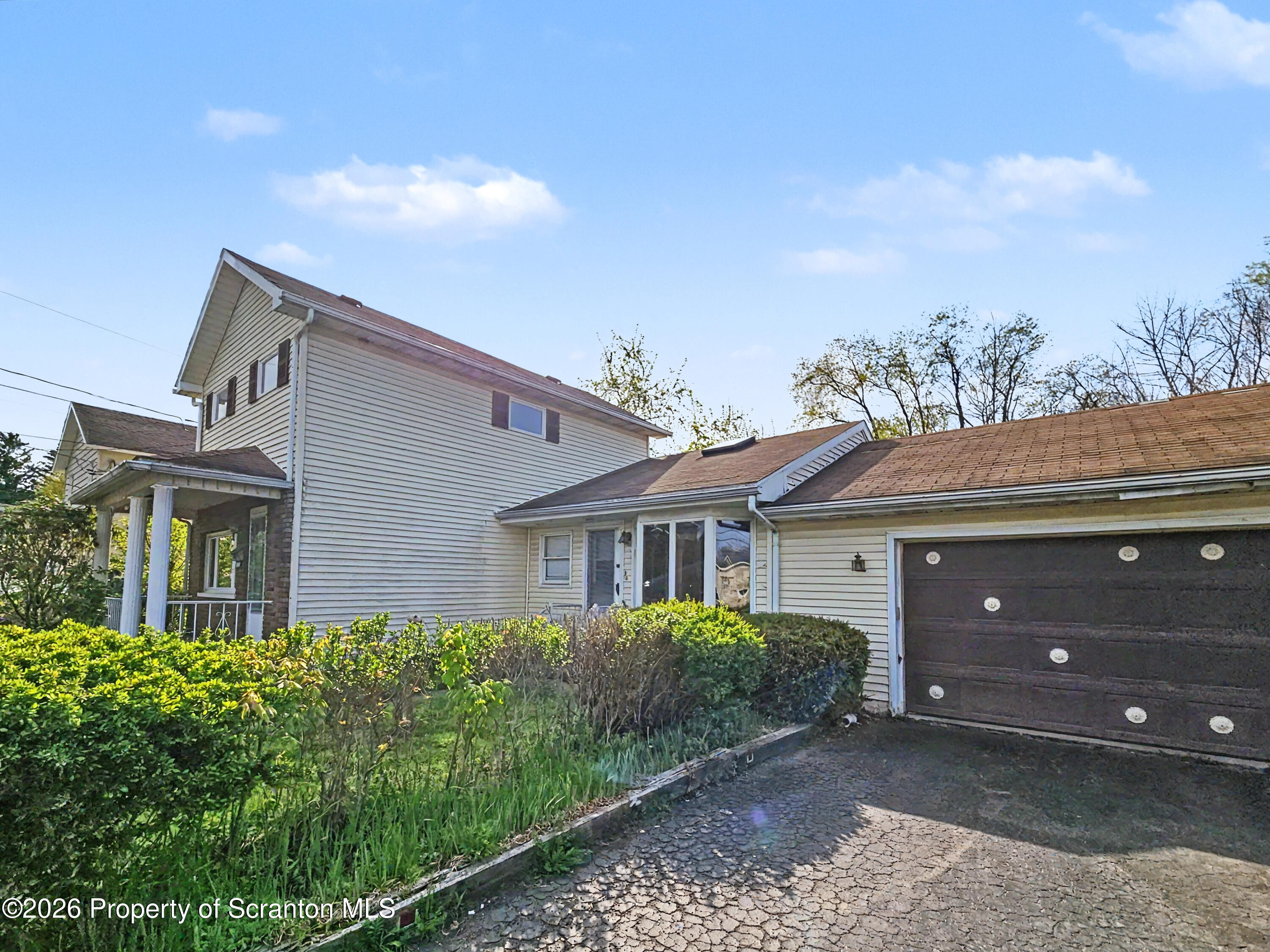 134 Lampman Street Avoca, PA 18641 - Photo 22 of 22 a house view with a garden space