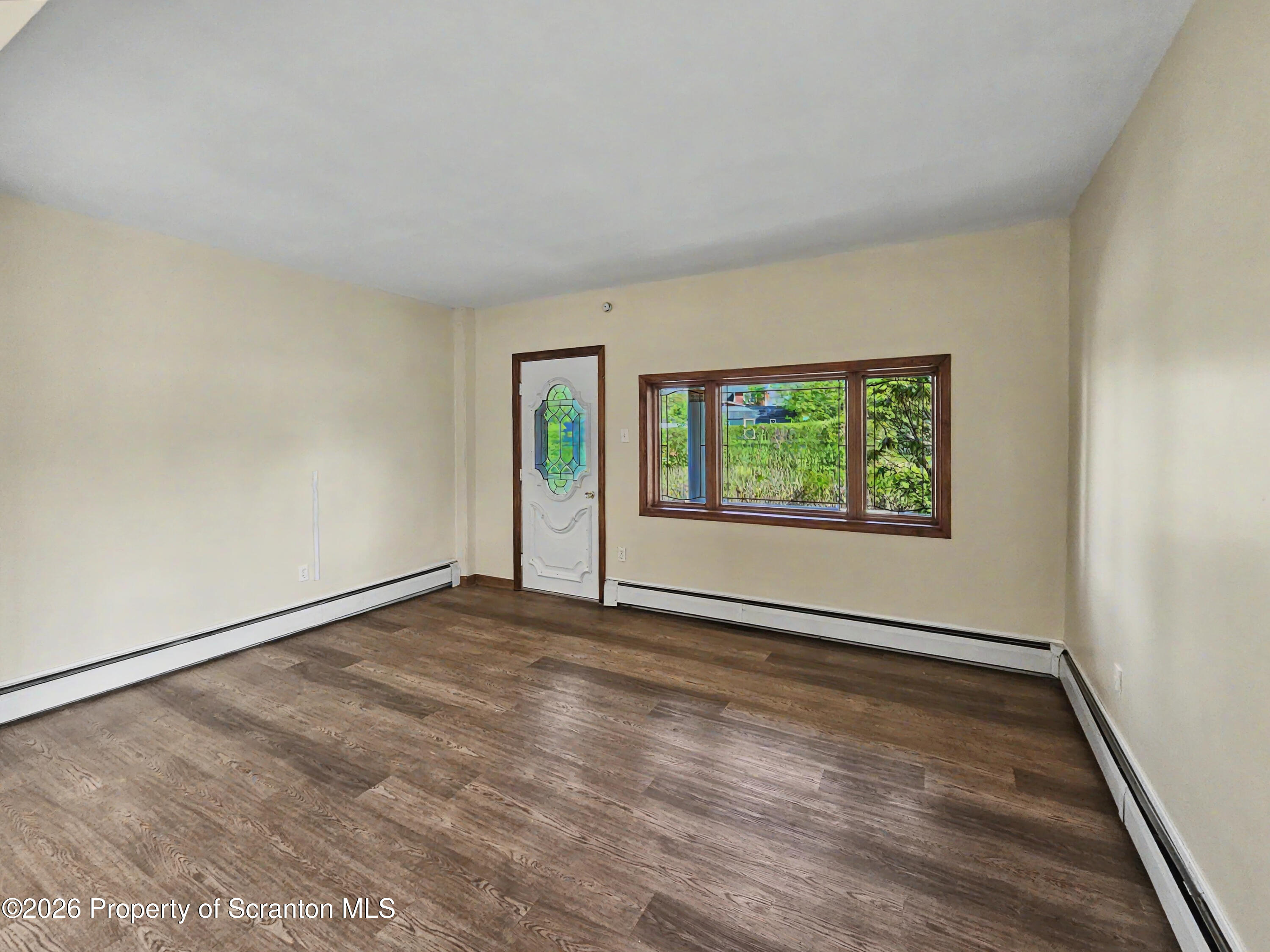 134 Lampman Street Avoca, PA 18641 - Photo 7 of 22 a view of an empty room with a window