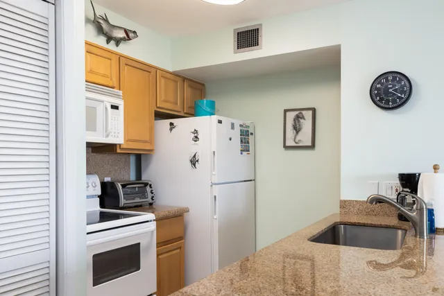 a view of a living room and workspace