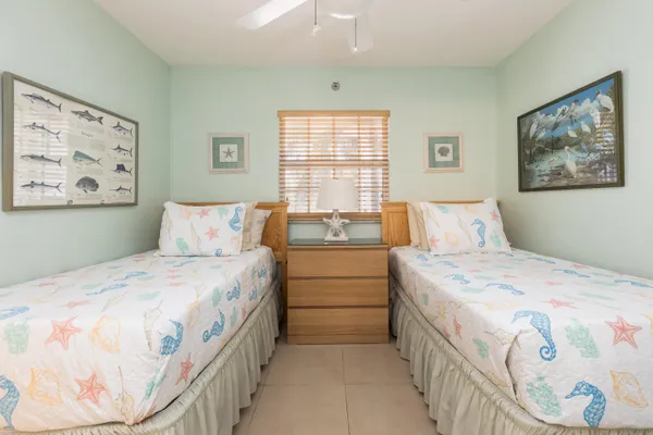 a bedroom with a bed and a dresser in it