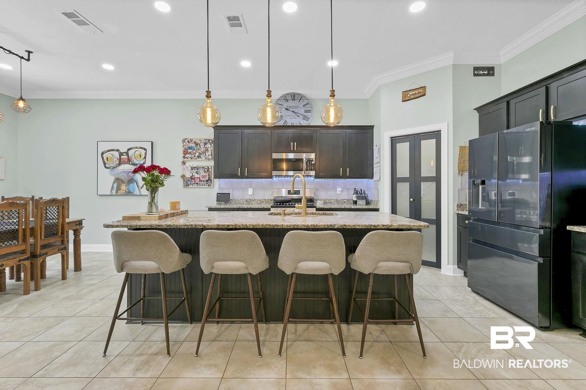 30635 Drayton Court Daphne, AL 36527 - Photo 12 of 51 Kitchen featuring refrigerator with ice dispenser, tasteful backsplash, ornamental molding, light stone countertops, and stainless steel microwave