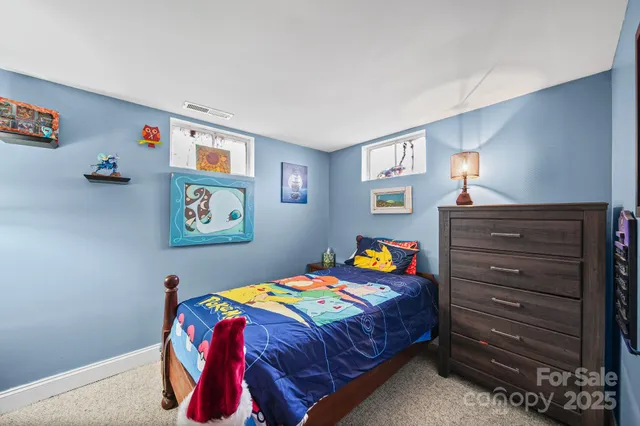 a bathroom with a granite countertop sink a mirror and shower