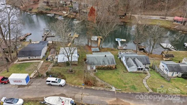 an aerial view of residential house with outdoor space and parking