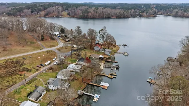 an aerial view of residential house with outdoor space and trees