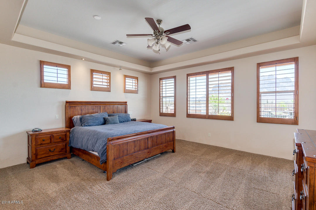 1982 North Goldfield Road Apache Junction, AZ 85119 - Photo 21 of 86 a spacious bedroom with a bed and window