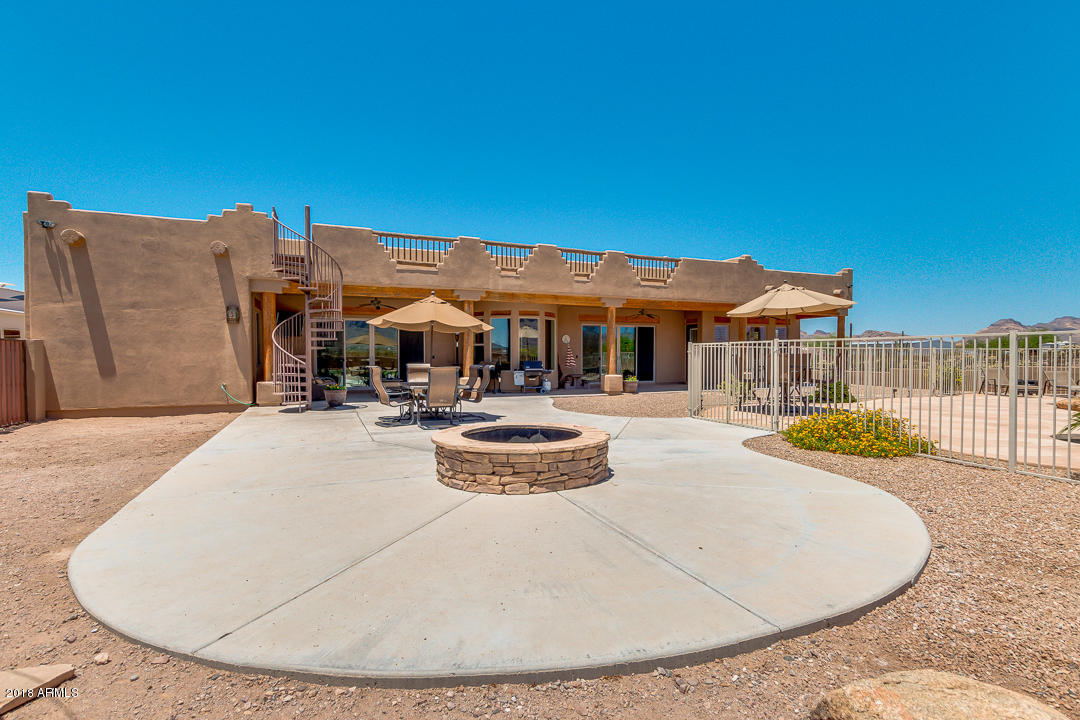 1982 North Goldfield Road Apache Junction, AZ 85119 - Photo 41 of 86 a view of a house with swimming pool and sitting area