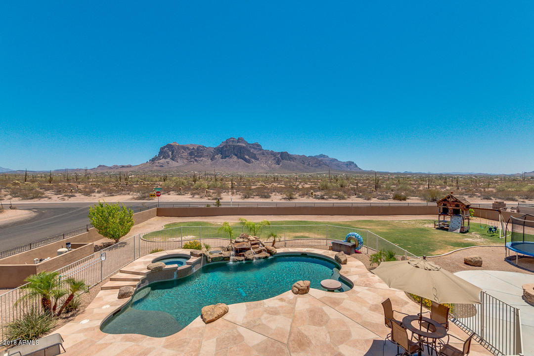 1982 North Goldfield Road Apache Junction, AZ 85119 - Photo 45 of 86 a view of a lake with houses in the background