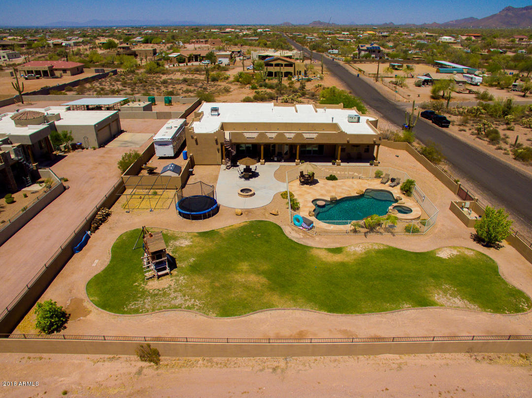 1982 North Goldfield Road Apache Junction, AZ 85119 - Photo 77 of 86 an aerial view of a house with yard swimming pool and outdoor seating