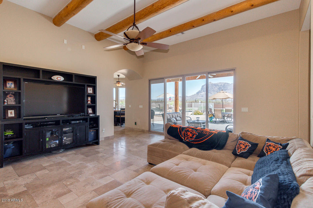 1982 North Goldfield Road Apache Junction, AZ 85119 - Photo 8 of 86 a living room with furniture and a flat screen tv
