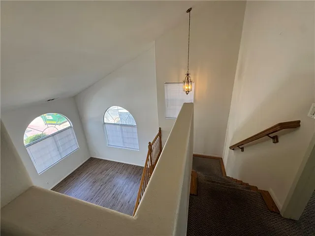 a view of a living room with furniture and a window
