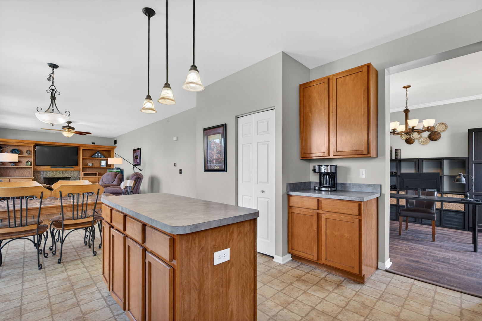 25204 Spring Street Manhattan, IL 60442 - Photo 7 of 34 a kitchen with stainless steel appliances granite countertop a sink a stove and a wooden cabinets