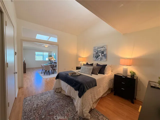 a bedroom with a bed and a couch